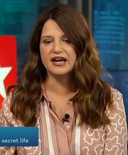 Jenifer Faison’s beige contrast print shirt on Access Hollywood