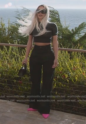 Kim’s short sleeve top and handbag on The Kardashians
