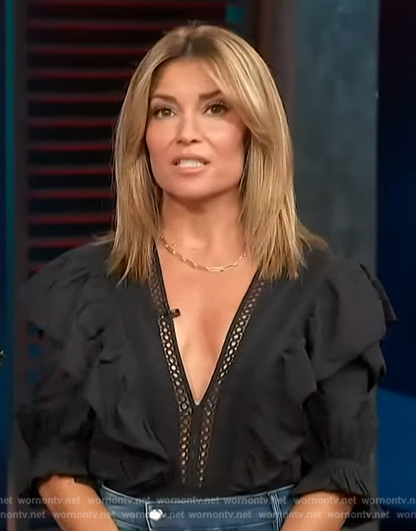 Kit’s black plunging lace trim top on Access Hollywood