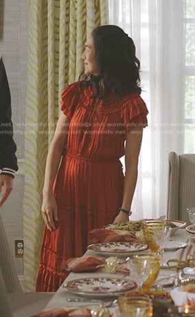 Laurel’s orange pleated midi dress on The Summer I Turned Pretty