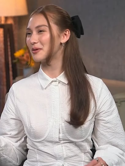 Lola Tung’s white corset blouse on Access Hollywood