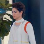 Marco’s white feather cuff blouse and knit vest on Glamorous