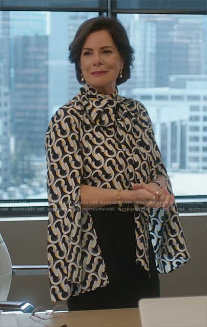 Margaret’s geometric print split sleeve blouse on So Help Me Todd
