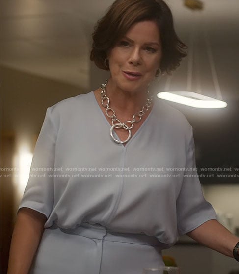Margaret’s light blue v-neck top on So Help Me Todd