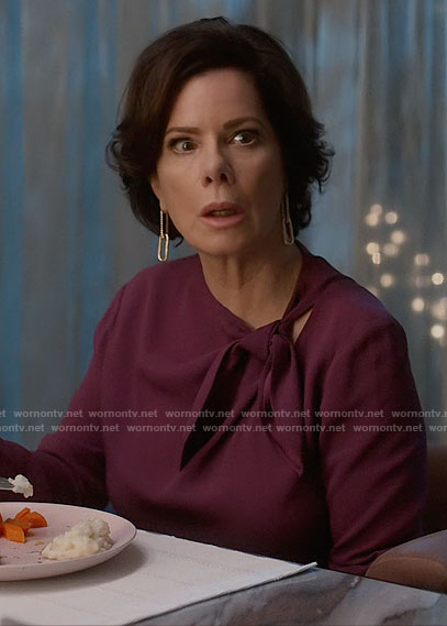 Margaret’s purple tie neck blouse on So Help Me Todd