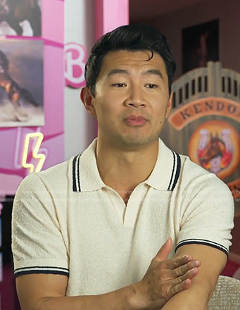 Simu Liu’s white bucle pol shirt on E! News