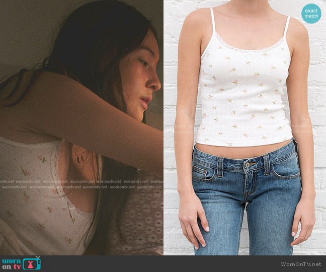 Brandy Melville Skyla Floral Bow Tank in white/pink/green floral worn by Belly Conklin (Lola Tung) on The Summer I Turned Pretty