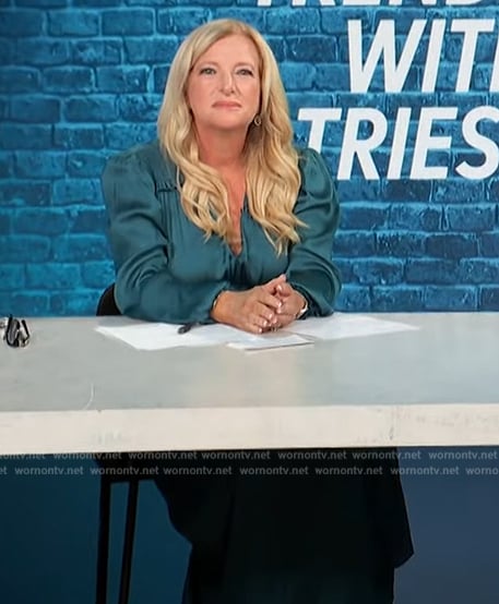 Alison Triessl’s blue satin smocked waist dress on Access Hollywood