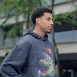 Junior’s black crocodile print hoodie on Grown-ish