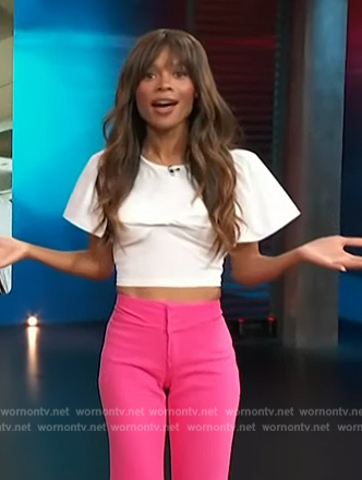 Zuri’s white puff sleeve twist front top on Access Hollywood