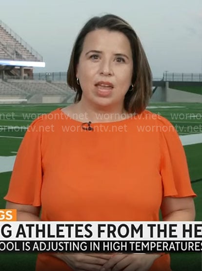 Andrea Lucia’s orange top on CBS Mornings