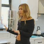 Erin’s black asymmetric button cardigan on The Real Housewives of New York City