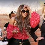 Gina’s red polka dot off shoulder top on The Real Housewives of Orange County