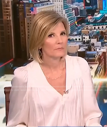 Kate Snow’s white v-neck blouse on NBC News