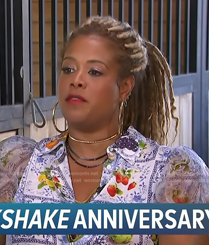 Kelis’s blue floral print short sleeve top on Access Hollywood