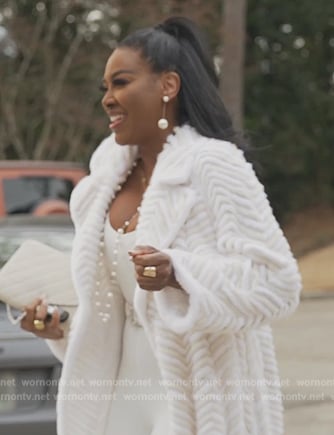 Kenya’s white fur trench coat on The Real Housewives of Atlanta