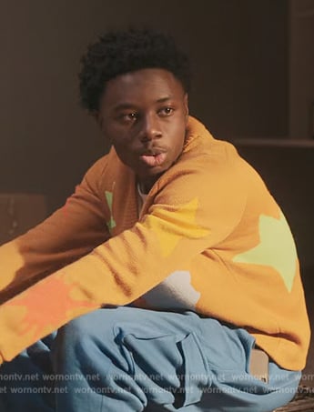 Kevin’s orange star print cardigan on The Chi