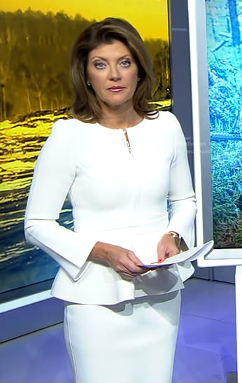 Norah’s white peplum jacket and skirt on CBS Evening News