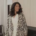 Seema’s abstract print coat and leather bag on And Just Like That