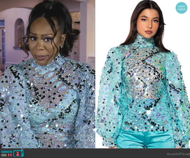 Shop Akira Confetti Long Sleeve Mock Neck Blouse worn by Sanya Richards-Ross on The Real Housewives of Atlanta
