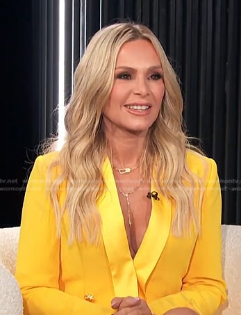 Tamra Judge’s yellow blazer dress and heel sandals on E! News