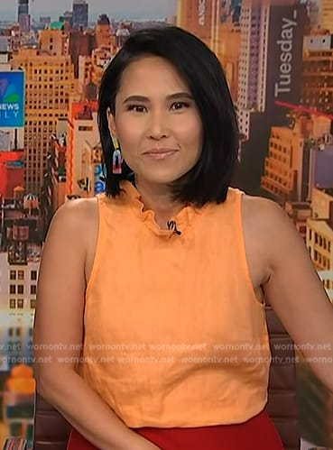 Vicky’s orange ruffle neck top on NBC News Daily