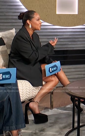 Adrienne’s black platform boots on E! News