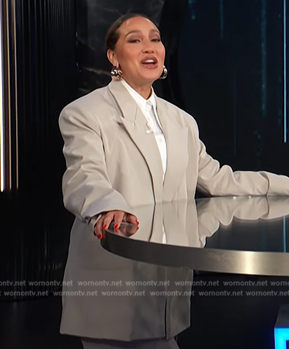 Adrienne’s gray blazer and pants on E! News