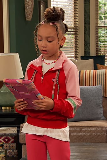 Alice’s pink and red top on Ravens Home