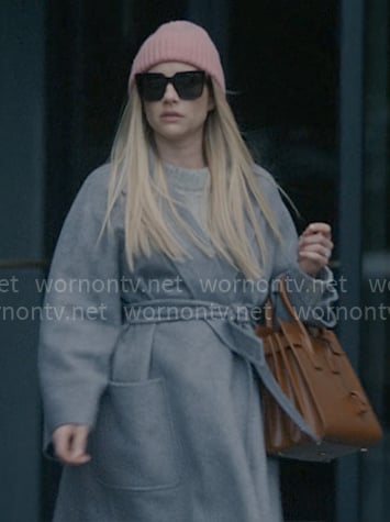 Anna’s grey wrap coat, brown bag, sunglasses and boots on American Horror Story Delicate
