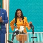 Elizabeth Werner’s orange draped wrap dress on CBS Mornings