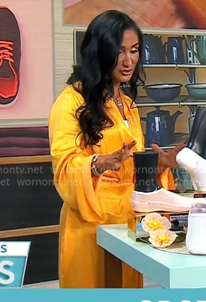 Elizabeth Werner’s orange draped wrap dress on CBS Mornings