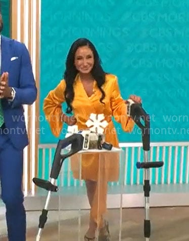 Elizabeth Werner’s orange draped wrap dress on CBS Mornings