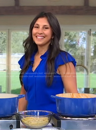 Gina Homolka’s blue ruffle short sleeve top on Good Morning America