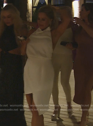 Jennifer’s white satin asymmetric mini dress on The Real Housewives of Orange County