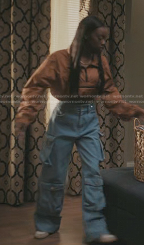 Kiesha’s brown half zip nylon top and cargo jeans on The Chi