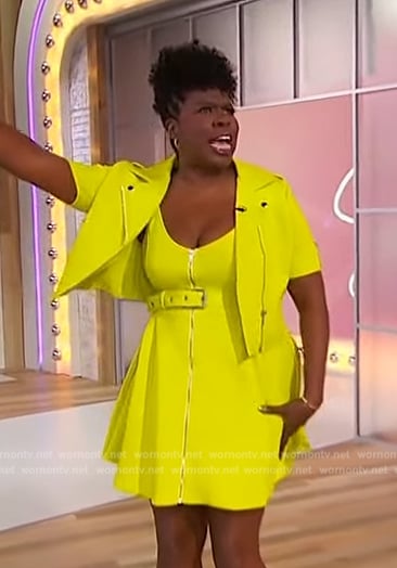 Leslie Jones’ lime leather jacket and belted dress on Sherri