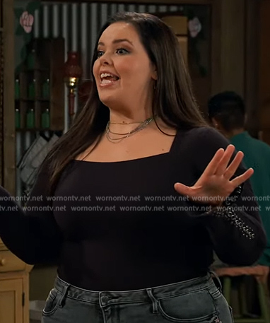 Lou’s black square neck top and floral jeans on Bunkd