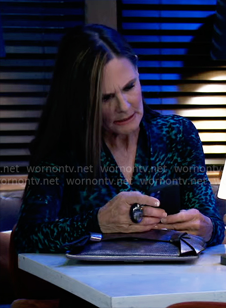 Lucy’s teal green leopard print dress and earrings on General Hospital