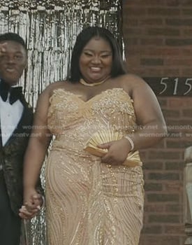 Maisha’s gold fan clutch on The Chi