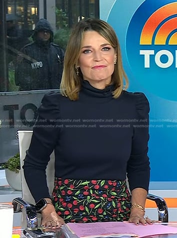 Savannah’s navy puff sleeve turtleneck and cherry print skirt on Today
