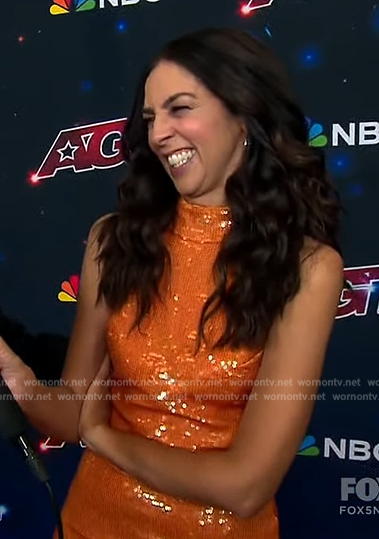 Terri Seymore’s orange sequin mini dress on Extra