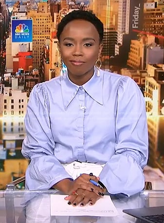 Zinhle’s blue bell sleeve shirt and white tie waist skirt on NBC News Daily