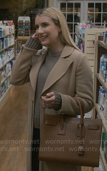 Anna’s long camel coat and taupe sweater on American Horror Story