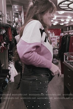 Brynn’s colorblock sweatshirt and studded jeans on The Real Housewives of New York City