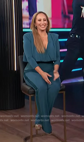 Cheryl Burke’s teal v-neck jumpsuit on E! News
