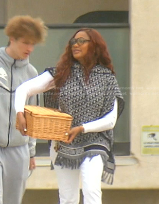Garcelle’s blue monogram poncho on The Real Housewives of Beverly Hills