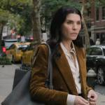 Laura’s corduroy blazer and leather tote bag on The Morning Show