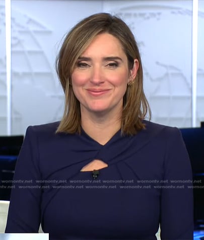 Margaret’s navy twisted neck dress on CBS Evening News
