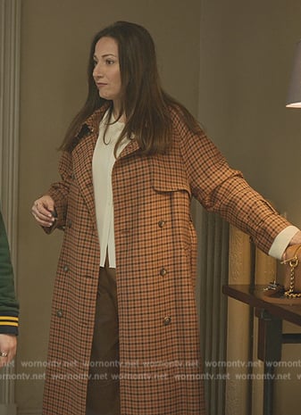 Maria’s orange gingham check trench coat on Elite